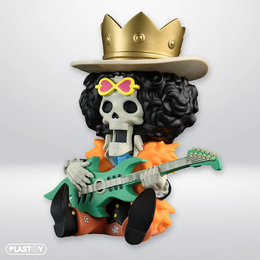 Tirelire Brook - Vue de profil du musicien squelette en PVC haute qualité